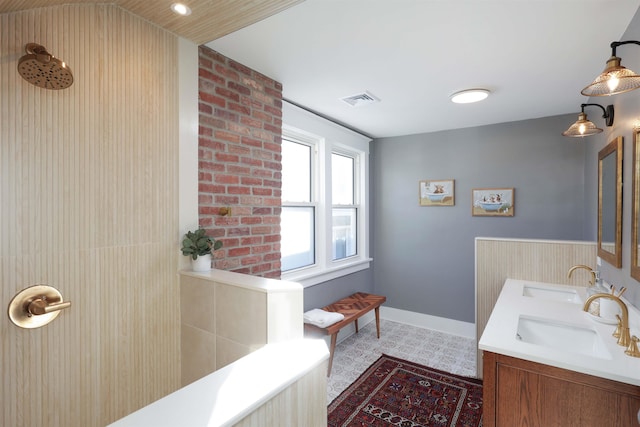 bathroom with vanity, a shower, and vaulted ceiling