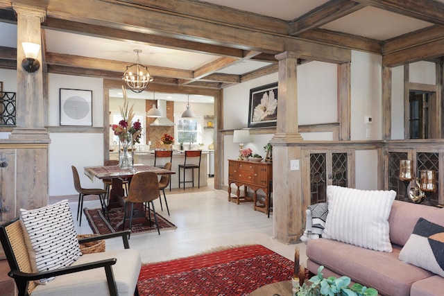 living room with coffered ceiling, light wood-type flooring, beamed ceiling, a notable chandelier, and decorative columns