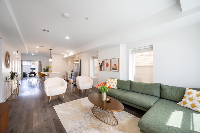 living room featuring recessed lighting, visible vents, and dark wood-style flooring