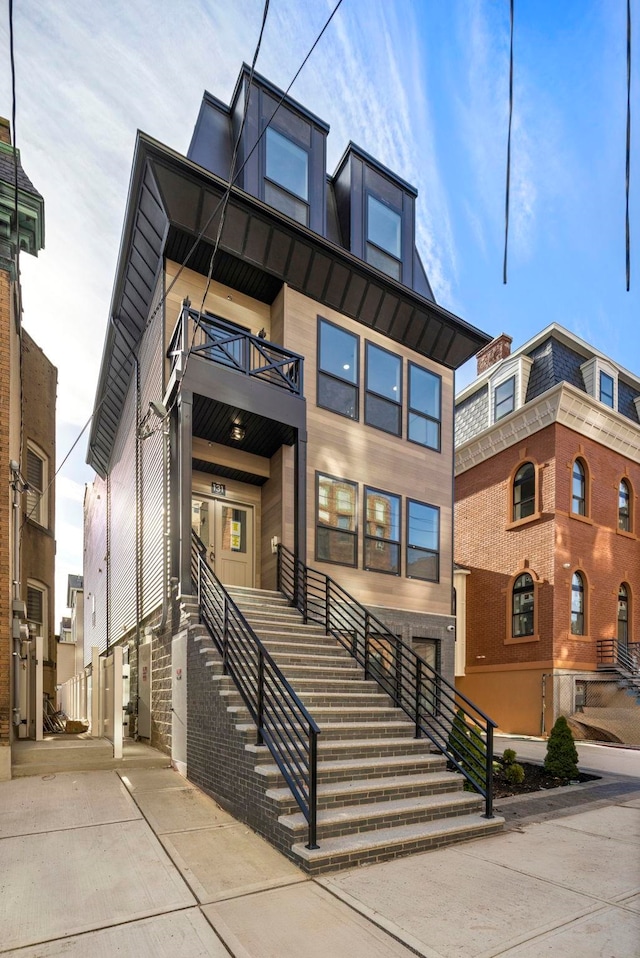 view of front of property with a balcony