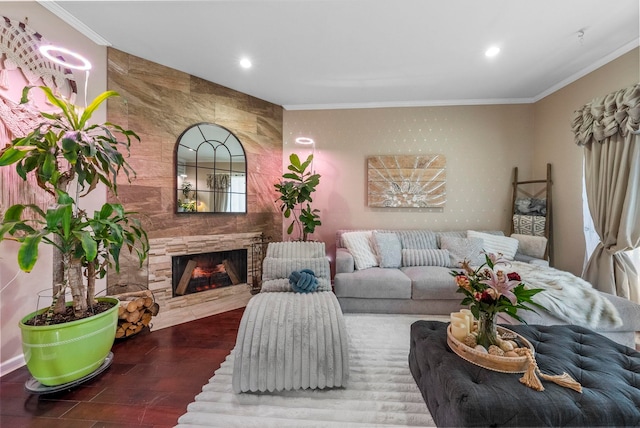 living room featuring recessed lighting, a large fireplace, and ornamental molding