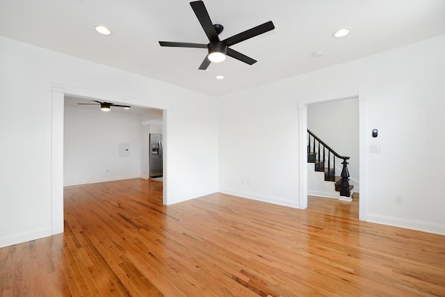 unfurnished room with light hardwood / wood-style floors and ceiling fan