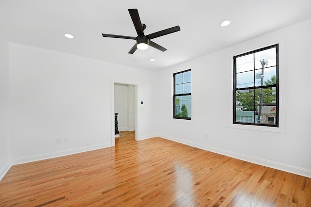 unfurnished room with light hardwood / wood-style floors and ceiling fan