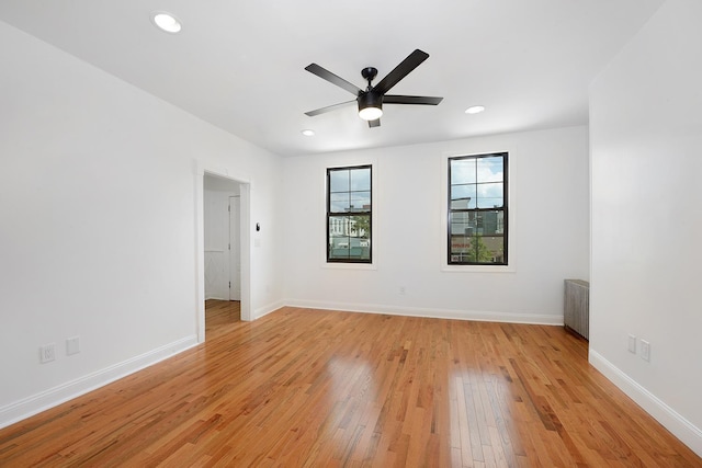 spare room featuring ceiling fan and light wood-type flooring