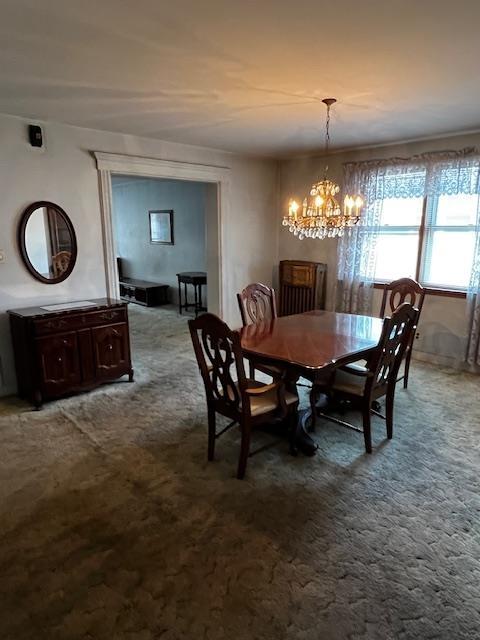 40 E 31st St, Bayonne, NJ 07002 - dining area with a chandelier and carpet floors