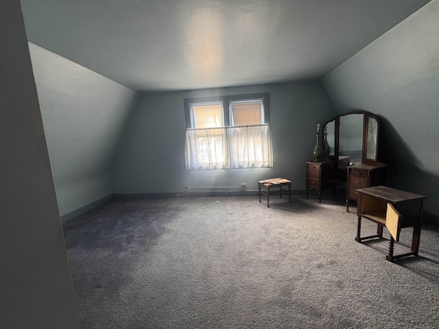 sitting room featuring baseboards, vaulted ceiling, and carpet flooring