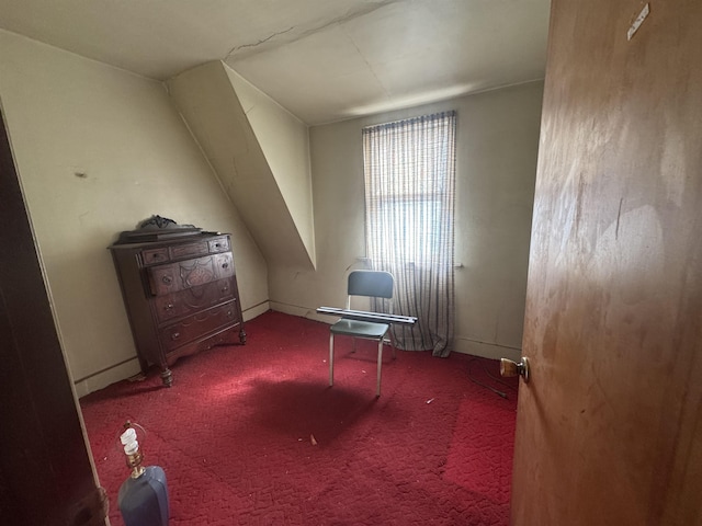 interior space with carpet floors and baseboards