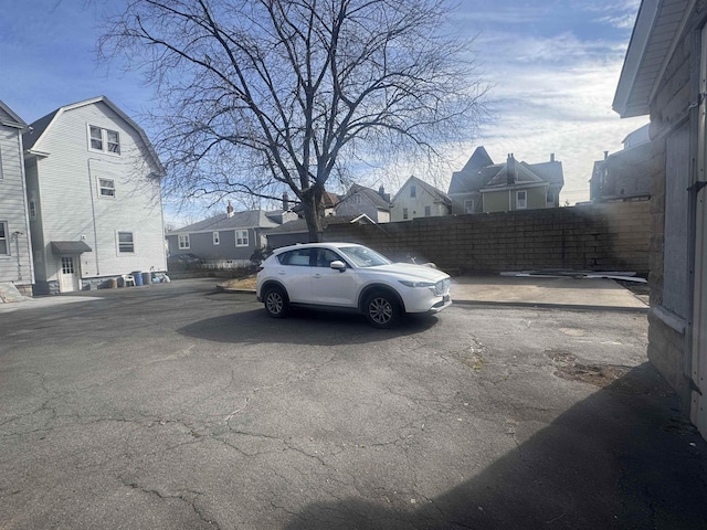 exterior space with a residential view and fence