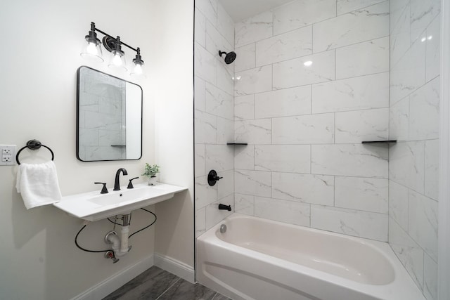 bathroom featuring tiled shower / bath and hardwood / wood-style flooring