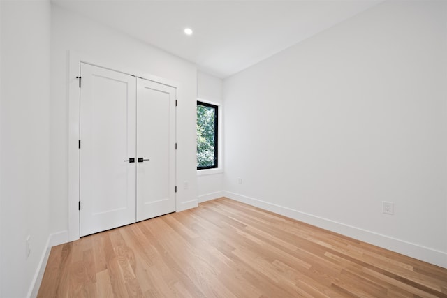 28 Beacon Ave Unit 2, Jersey City, NJ 07306 - unfurnished bedroom featuring light wood-style floors, recessed lighting, and a closet