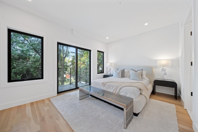 28 Beacon Ave Unit 2, Jersey City, NJ 07306 - bedroom featuring access to outside, light wood-style floors, and recessed lighting