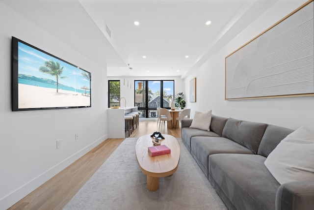 28 Beacon Ave Unit 2, Jersey City, NJ 07306 - living area with recessed lighting and light wood-style floors