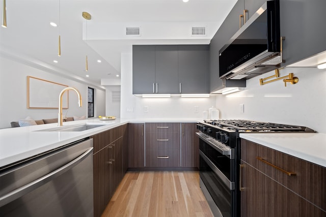28 Beacon Ave Unit 2, Jersey City, NJ 07306 - kitchen with appliances with stainless steel finishes, modern cabinets, light countertops, light wood finished floors, and recessed lighting