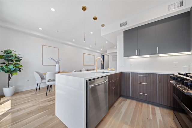 28 Beacon Ave Unit 2, Jersey City, NJ 07306 - kitchen featuring dishwasher, gas range oven, modern cabinets, a peninsula, and light wood finished floors