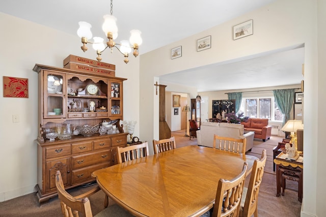 306 Sylvan St, Rutherford, NJ 07070 - carpeted dining area with a chandelier and radiator