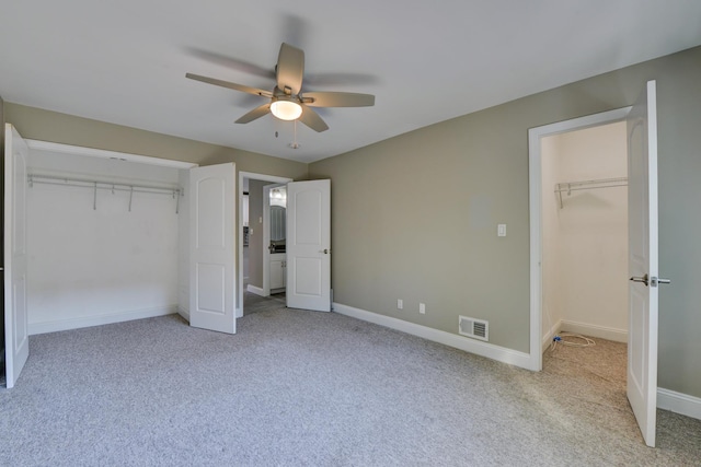 98 Sandpiper Ky, Secaucus, NJ 07094 - unfurnished bedroom with light carpet, a spacious closet, and a ceiling fan