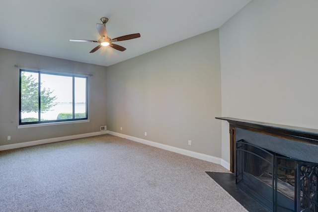 98 Sandpiper Ky, Secaucus, NJ 07094 - unfurnished living room with ceiling fan, carpet flooring, and a fireplace with flush hearth
