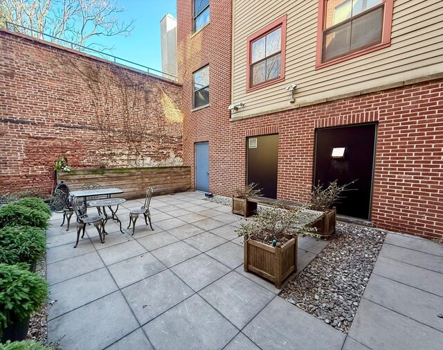 view of patio featuring outdoor dining area