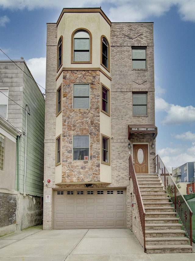 517 19th St # 2, Union City, NJ 07087 - townhome / multi-family property featuring driveway, a garage, and stone siding