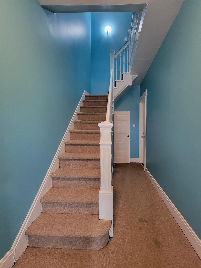 1214 79th St, North Bergen, NJ 07047 - stairway featuring carpet flooring and baseboards