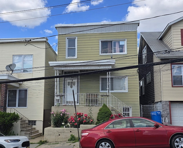 1214 79th St, North Bergen, NJ 07047 - view of front of property with stairs and covered porch