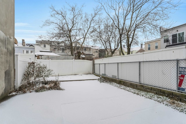 view of yard layered in snow