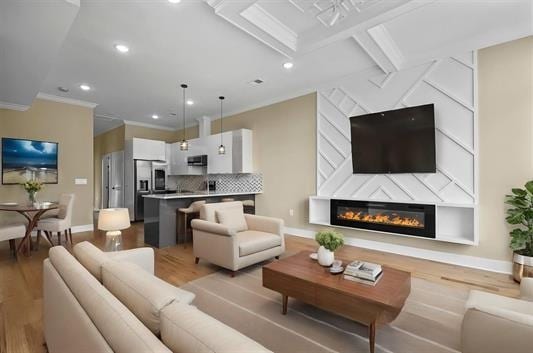 3611 John F Kennedy Blvd Unit 2, Jersey City, NJ 07307 - living room featuring light wood-style flooring, ornamental molding, baseboards, recessed lighting, and a glass covered fireplace