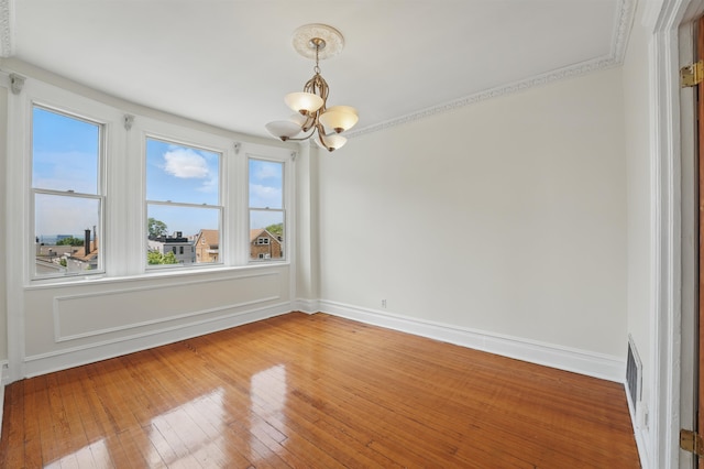 3444 John F Kennedy Blvd Unit 4F, Jersey City, NJ 07307 - spare room featuring a chandelier, light wood-type flooring, and baseboards