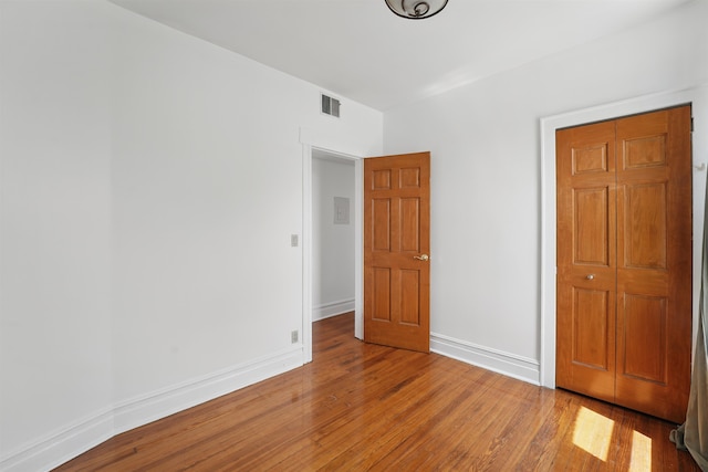3444 John F Kennedy Blvd Unit 4F, Jersey City, NJ 07307 - unfurnished bedroom featuring wood finished floors, baseboards, and a closet