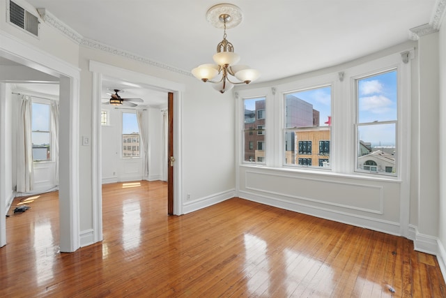 3444 John F Kennedy Blvd Unit 4F, Jersey City, NJ 07307 - unfurnished dining area featuring healthy amount of natural light, a chandelier, and wood-type flooring