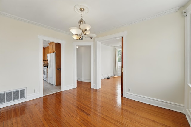 3444 John F Kennedy Blvd Unit 4F, Jersey City, NJ 07307 - spare room with a chandelier, light wood finished floors, ornamental molding, and baseboards