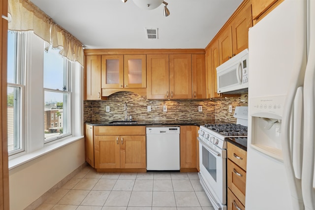3444 John F Kennedy Blvd Unit 4F, Jersey City, NJ 07307 - kitchen featuring white appliances, a sink, light tile patterned flooring, decorative backsplash, and glass insert cabinets