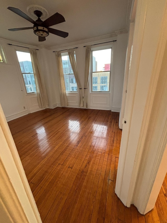 3444 John F Kennedy Blvd Unit 4F, Jersey City, NJ 07307 - spare room featuring ceiling fan, hardwood / wood-style flooring, and a decorative wall