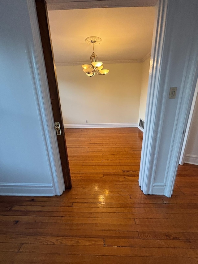 3444 John F Kennedy Blvd Unit 4F, Jersey City, NJ 07307 - hall featuring a chandelier, ornamental molding, dark wood finished floors, and baseboards