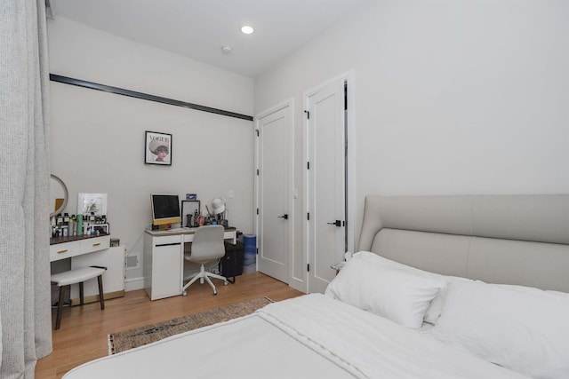 bedroom with light hardwood / wood-style flooring