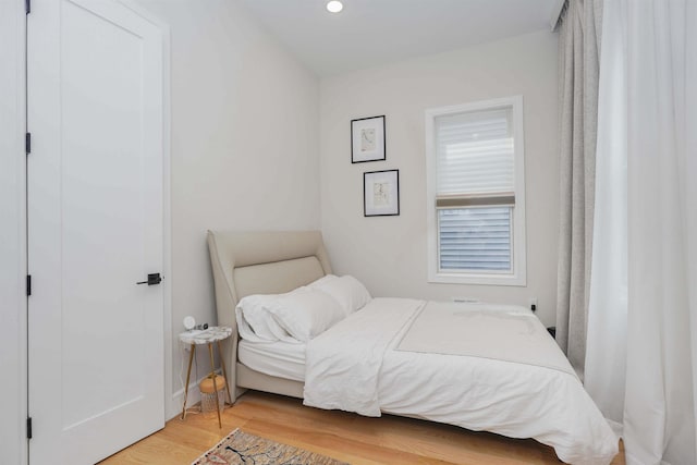 bedroom with hardwood / wood-style floors