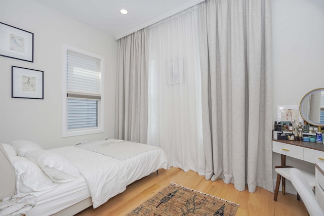 bedroom with hardwood / wood-style floors