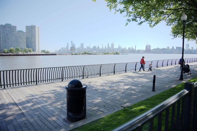 20 2nd St Unit 2111, Jersey City, NJ 07034 - wooden deck featuring a skyline view and a water view