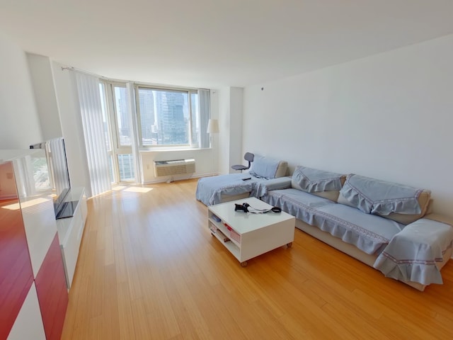 20 2nd St Unit 2111, Jersey City, NJ 07034 - living room with light wood-type flooring and an AC wall unit