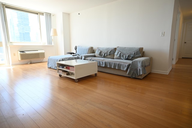 20 2nd St Unit 2111, Jersey City, NJ 07034 - living room featuring an AC wall unit and light wood-type flooring