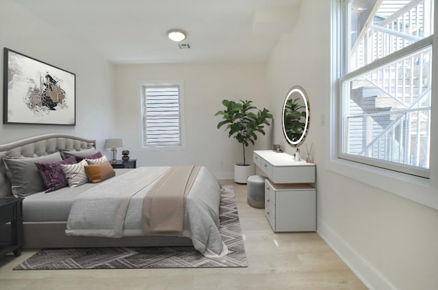 107 Laidlaw Ave Unit 2, Jersey City, NJ 07306 - bedroom with multiple windows and light wood-style floors
