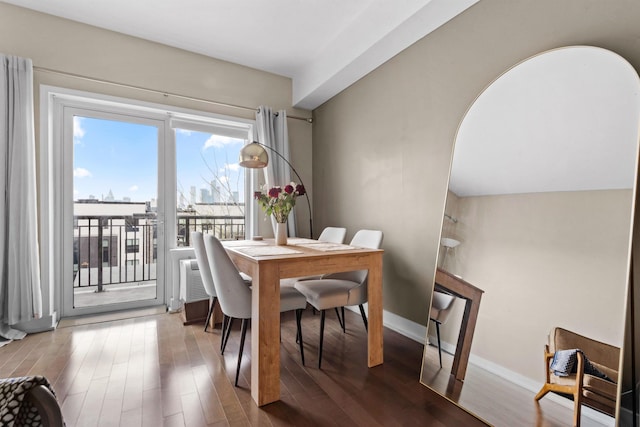 3312 Hudson Ave Unit 3H, Union City, NJ 07087 - dining space featuring wood finished floors, baseboards, and arched walkways