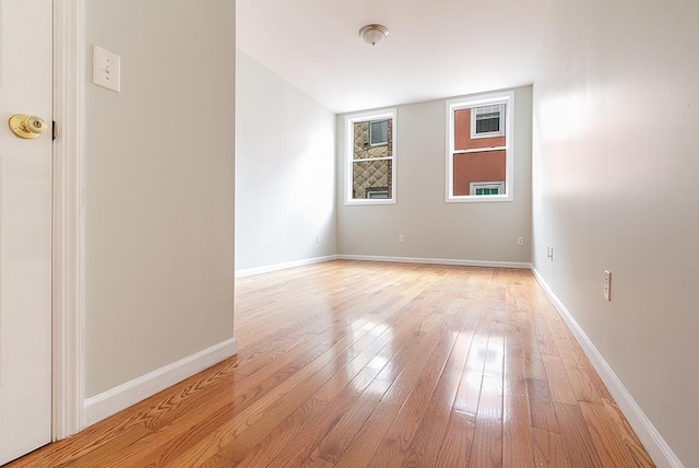 spare room featuring light hardwood / wood-style floors