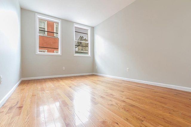 spare room featuring light hardwood / wood-style floors