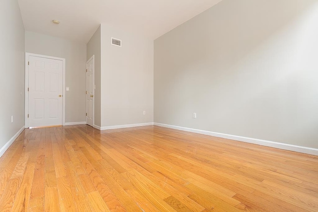 unfurnished room featuring light wood-type flooring