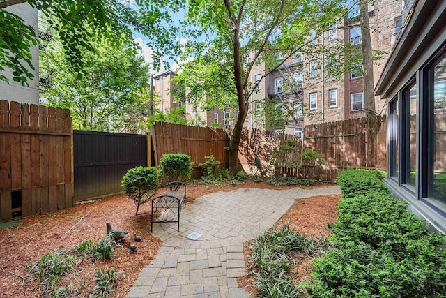 view of patio with a fenced backyard and a residential view