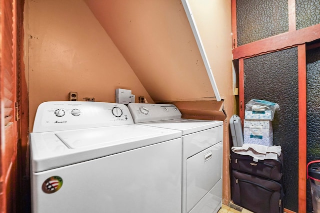 laundry room with laundry area and washing machine and clothes dryer