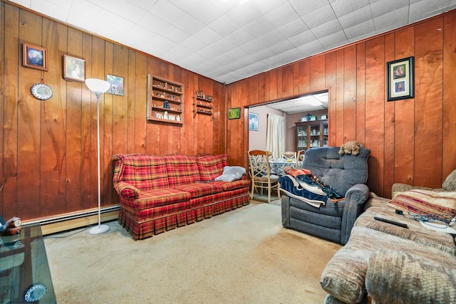 living area with carpet, wooden walls, and baseboard heating