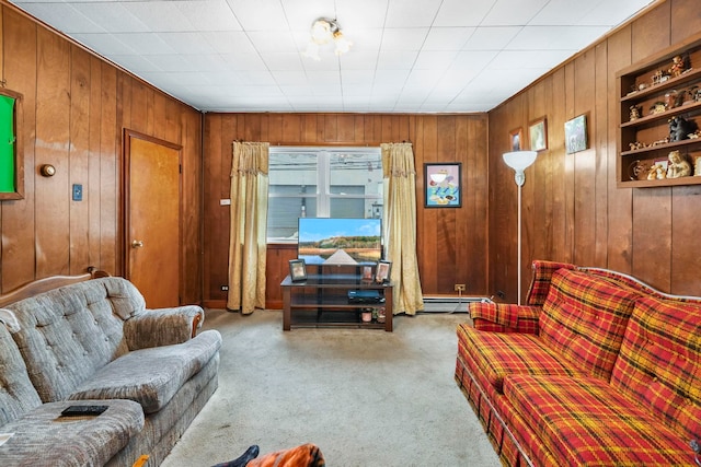 living area featuring wood walls, a baseboard heating unit, and carpet flooring