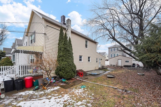 view of property exterior featuring a chimney